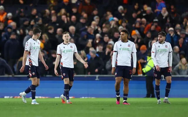 Bolton players look dejected after conceding the equaliser to Luton