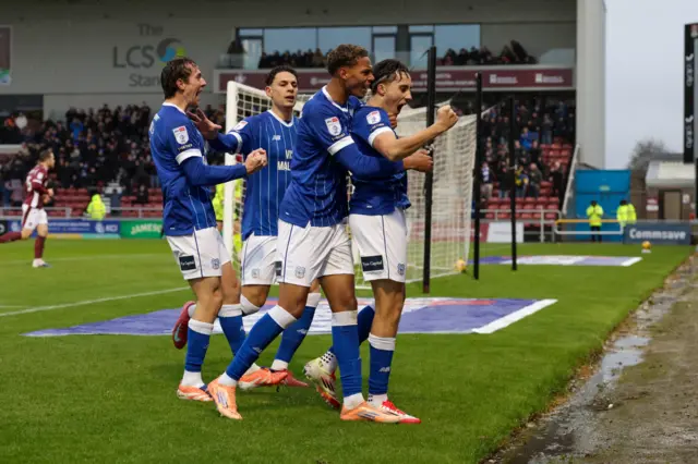 Cardiff players celebrate scoring in the win at Northampton