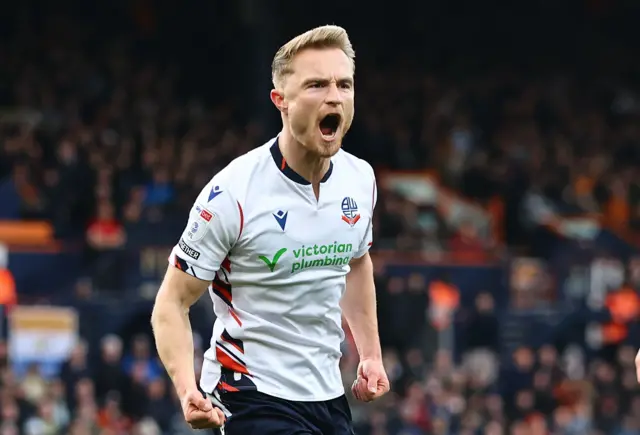 Kyle Dempsey celebrates scoring the opener for Bolton at Luton