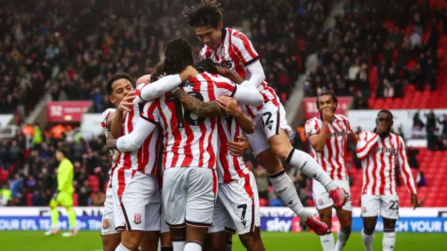 Stoke players celebrate with Sorba Thomas