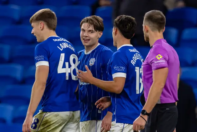 Cardiff players celebrate their third goal against Mansfield