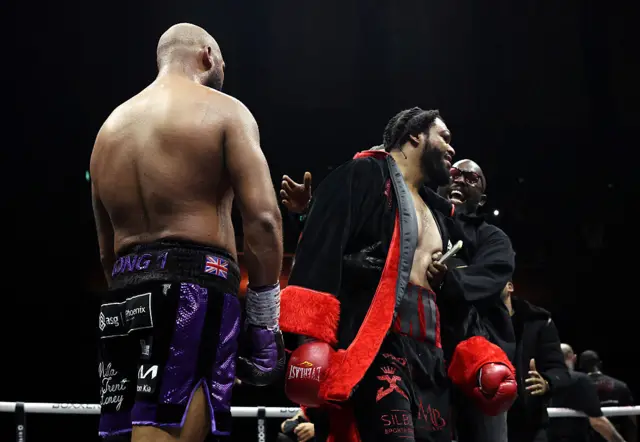 Jeamie TKV celebrates beside Frazer Clarke