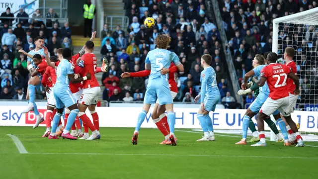 Bobby Thomas sends a header goalwards