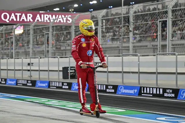 Lewis Hamilton on a scooter in the pit lane in Qatar