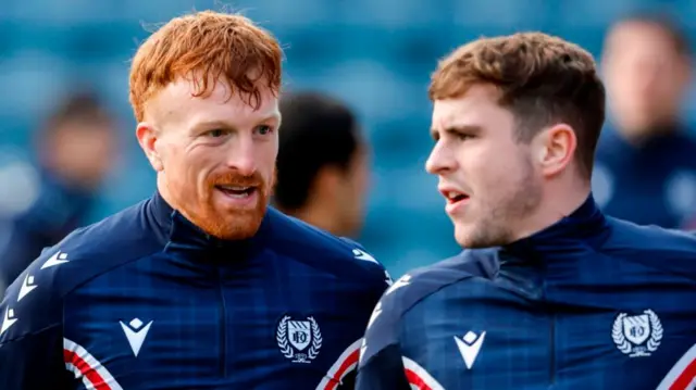 Dundee's Simon Murray (left) warms up