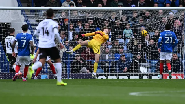 Portsmouth goalkeeper Nico Schmid is beaten by Anis Mehmeti's header