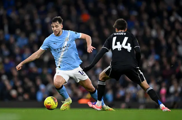 Nico Gonzalez is challenged by Ilia Gruev