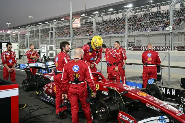 Lewis Hamilton gets in his car on the grid in Qatar