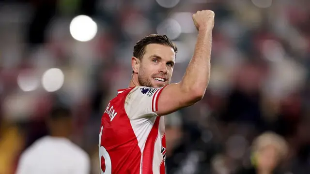 Jordan Henderson celebrates following the team's victory