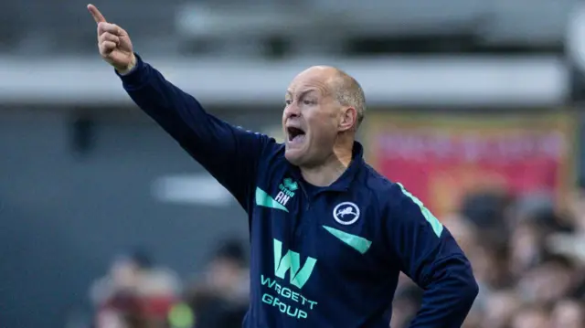 Millwall manager Alex Neil gestures to his players