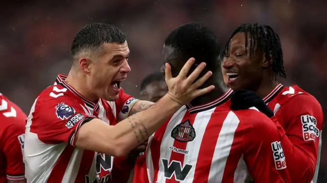 Brian Brobbey celebrates scoring his team's third goal with teammate Granit Xhaka