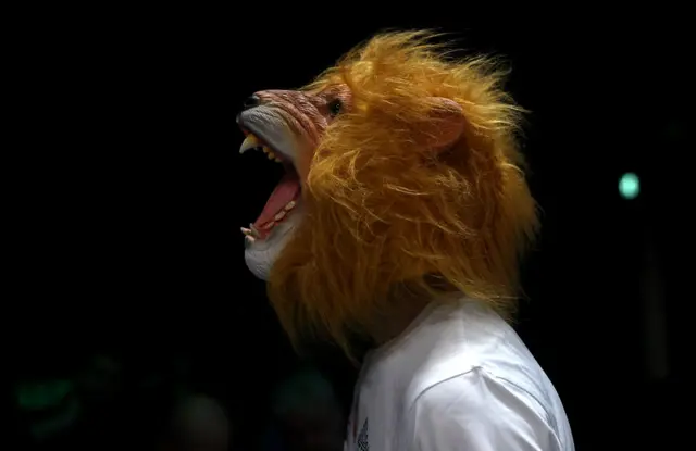 Scott Melvin wears a lion mask in his ringwalk
