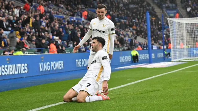 Tom Cannon slides on his knees in celebration