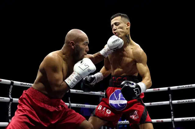 Jorge Luis Huerta Balleza punches Josh Rose during their super feather weight fight