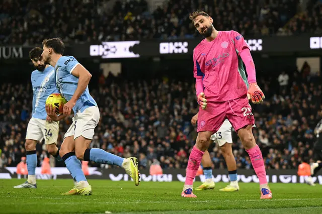 Gianluigi Donnarumma reacts