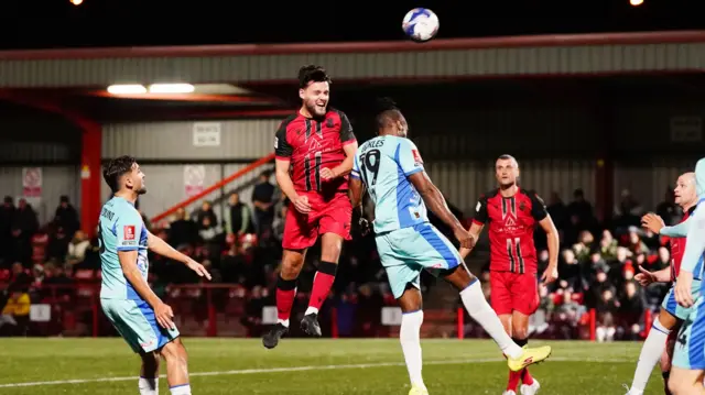 Tamworth's Stefan Mols heads towards goal