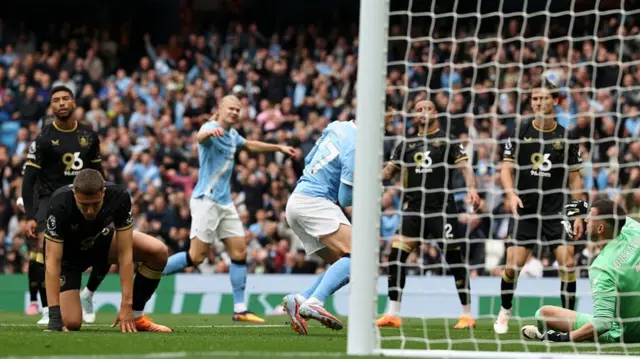 Maxime Esteve scores an own goal against Manchester City