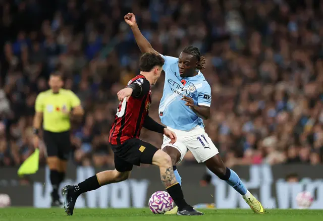 Manchester City Jeremy Doku is challenged by AFC Bournemouth's Julio Soler