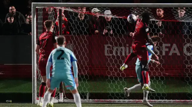 Tamworth's Kennedy Digie directs a cross into his own net