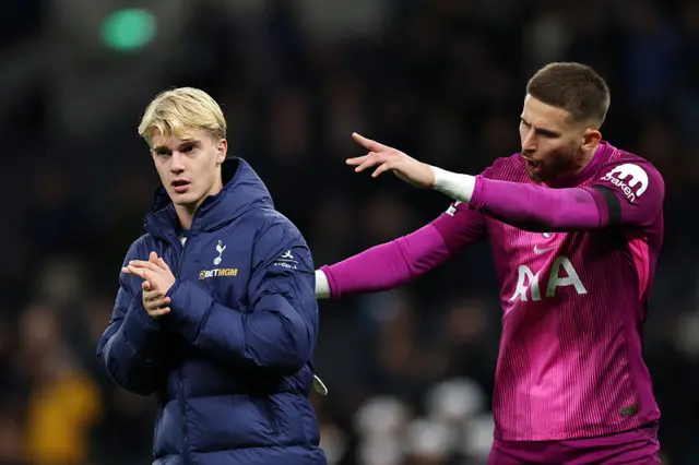 Lucas Bergvall of Tottenham Hotspur reacts alongside teammate Guglielmo Vicario