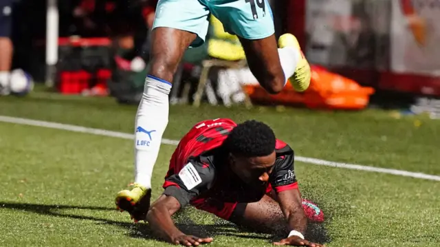 Beck-Ray Enoru hits the ground after being fouled by Leyton Orient's Omar Beckles