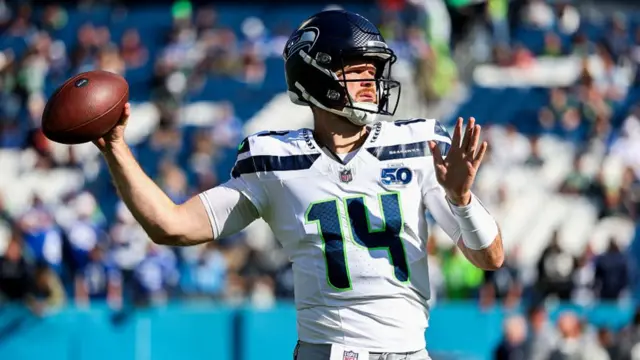 Sam Darnold throws the football