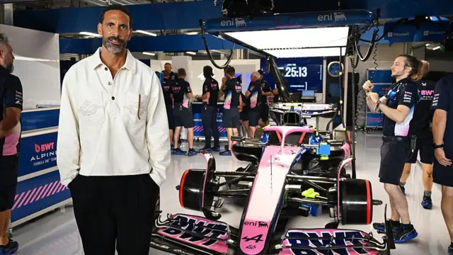 Former Manchester United and England footballer Rio Ferdinand outside the Alpine garage