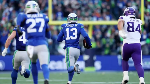 Ernest Jones IV picks off Max Brosmer and runs towards the endzone.