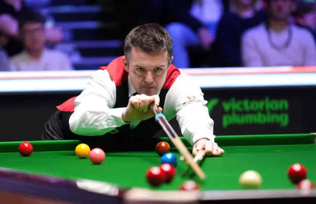 Michael Holt in action during his match against Wu Yize