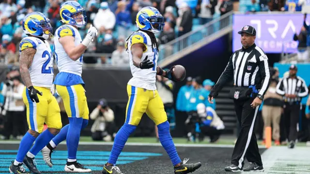 Davante Adams celebrates after scoring a touchdown against the Carolina Panthers.