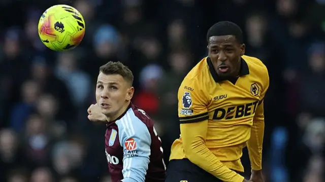 Lucas Digne and Jackson Tchatchoua go up for a header