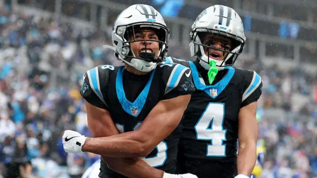 Jalen Coker celebrates after scoring a touchdown for the Panthers