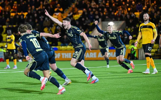 Aberdeen celebrate Nicky Devlin's late goal in Livingston