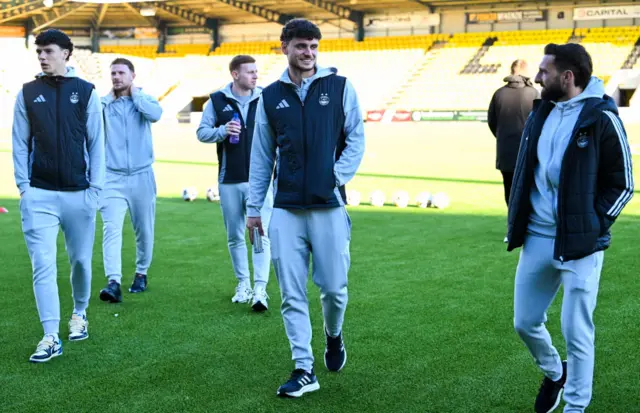 Aberdeen players check out the playing surface in sunny Livingston