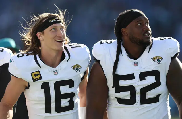 Trevor Lawrence and Davon Hamilton smile