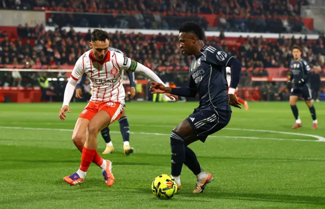 Vinicius Jr runs at a defender