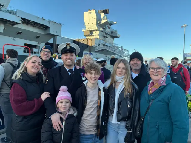 Andrew 'Bouncy' Ball is surrounded by his three children and partner Sammy Wardley