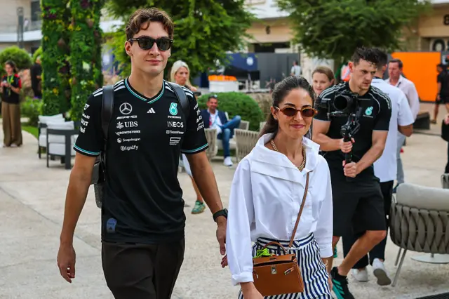 George Russell arrives with his girlfriend Carmen