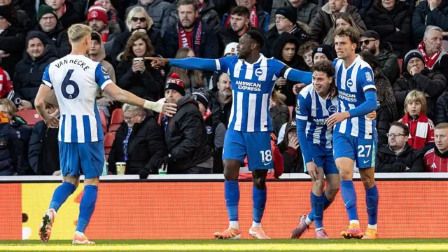 Brighton players celebrate after scoring a goal