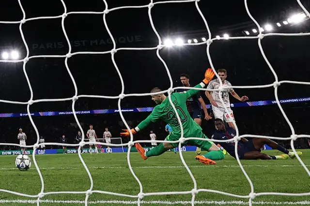 Paris Saint-Germain's French goalkeeper #30 Lucas Chevalier (C) concedes Bayern's second goal