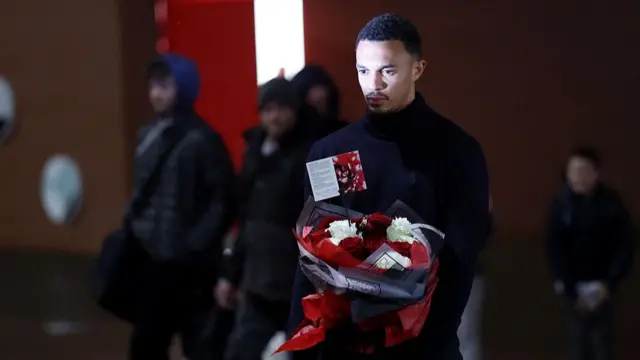 Trent Alexander-Arnold lays a wreath for Diogo Jota