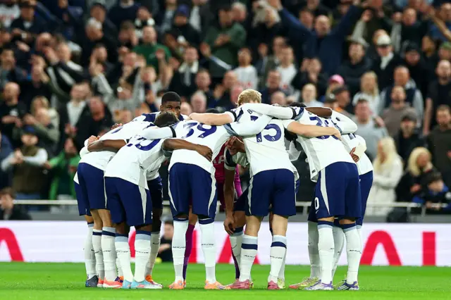 Tottenham players huddle during Chelsea match in Premier League