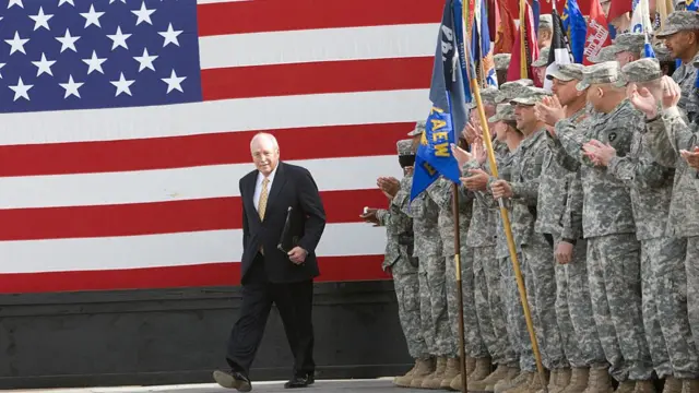 Vice-President Cheney takes to the stage on March 18, 2008, to deliver remarks to US troops stationed at Balad Air Base, Iraq