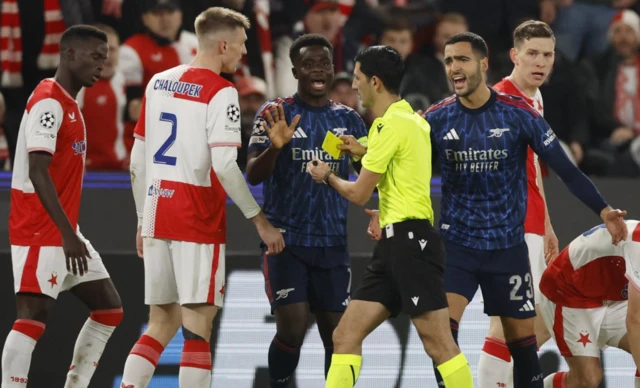 Mikel Merino is shown a yellow card