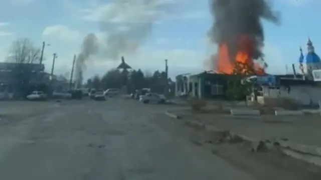 A screengrab showing a fire in a building in Petrovske following a reported Russian glide bomb attack