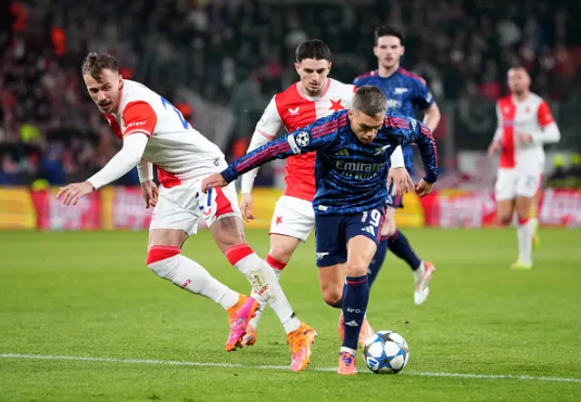 Leandro Trossard of Arsenal is put under pressure by Tomas Vlcek