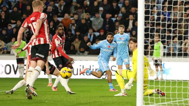 Coventry's Jay Dasilva sends a dangerous ball into the box