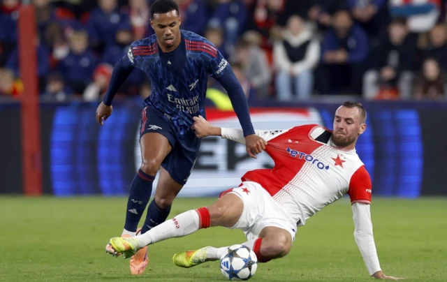 Arsenal's Gabriel Magalhaes in action with Slavia Prague's Tomas Chory