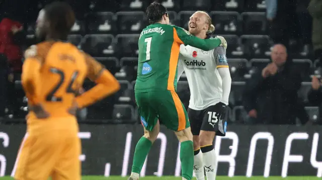 Lars-Jorden Salvesen celebrates his winner for Derby with goalkeeper Jacob Widell Zetterstrom