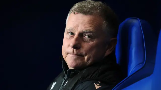 Stoke manager Mark Robins in the dugout at the Kassam Stadium